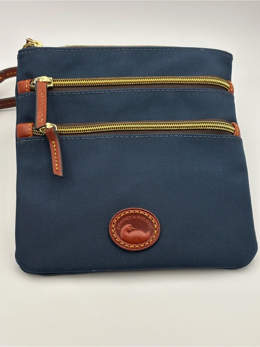 Dooney & Bourke Triple Zip Navy Crossbody with Brown Leather Trim